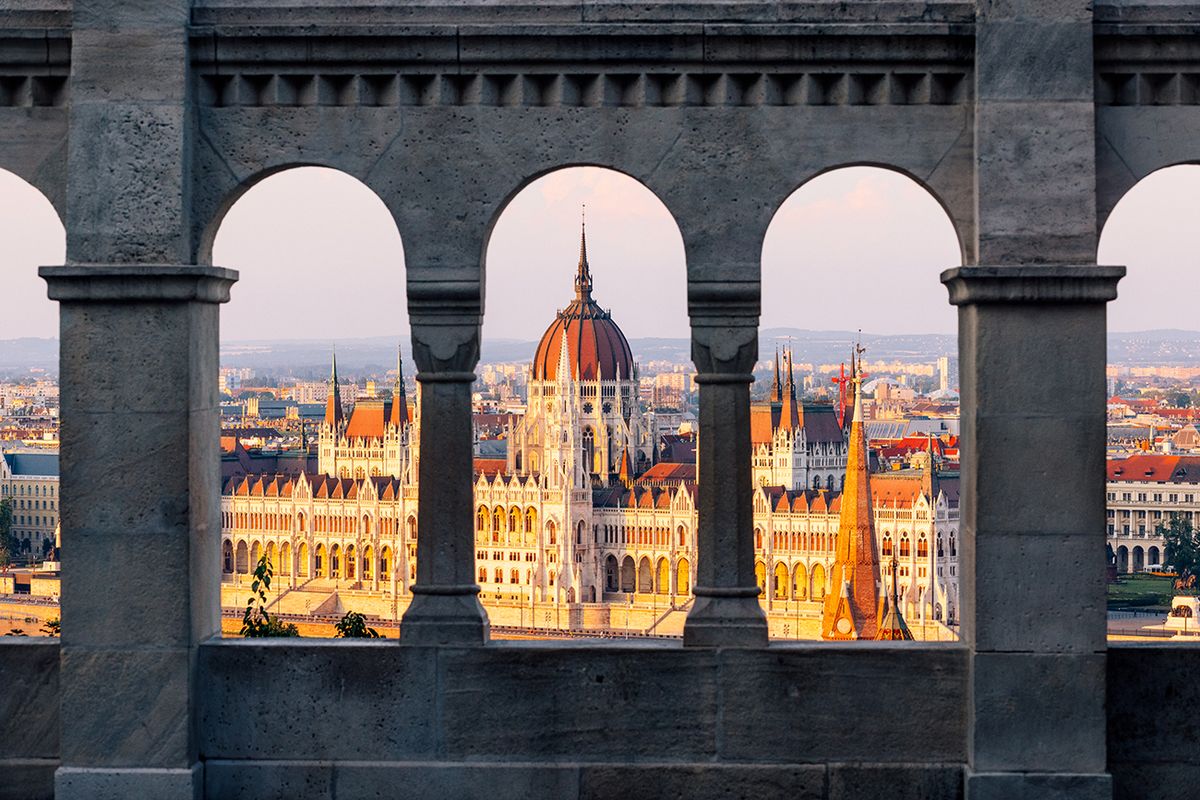 Hungarian Parliament seen through the arches of Fisherman's Bastion, Budapest, Hungary
