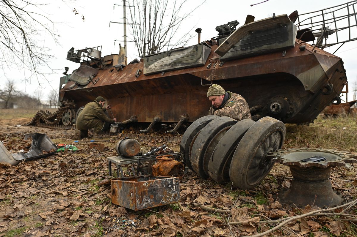 KHERSON, UKRAINE - December 18: Army mechanics extract parts from a damaged tank at the entrance to Kherson town, in  Kherson, Ukraine, on December 18, 2022.A month after liberation, the Ukrainian city of Kherson and the surrounding villages are daily bombarded by Russian troops from the left bank of the Dnieper. Rockets and missiles are fired all day, killing and injuring innocent people.Many who have returned are preparing for another trip to a safer place as normal life becomes impossible.