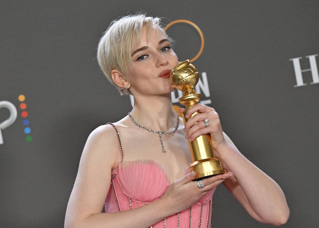 US actress Julia Garner poses with the award for Best Supporting Actress - Television Series for "Ozark" in the press room during the 80th annual Golden Globe Awards at The Beverly Hilton hotel in Beverly Hills, California, on January 10, 2023. 