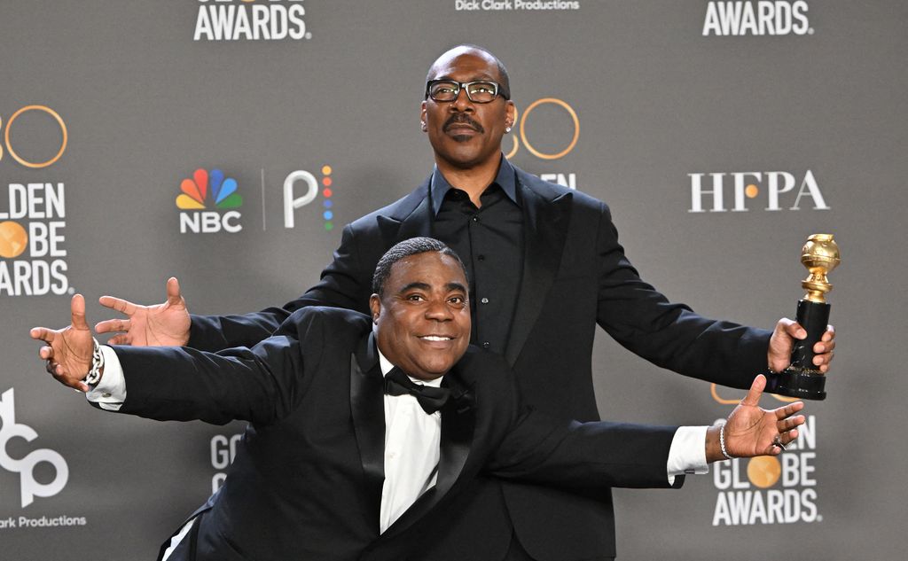 US actor Eddie Murphy (R) poses with the Cecil B. DeMille award alongside US comedian Tracy Morgan in the press room during the 80th annual Golden Globe Awards at The Beverly Hilton hotel in Beverly Hills, California, on January 10, 2023. 
