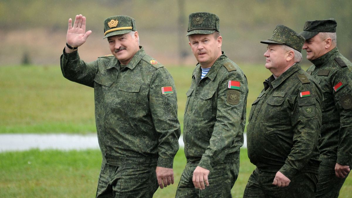 Belarus' President Alexander Lukashenko (L) waves as he arrives to inspect the joint Russian-Belarusian military exercises Zapad-2017 (West-2017) at a training ground near the town of Borisov on September 20, 2017. 