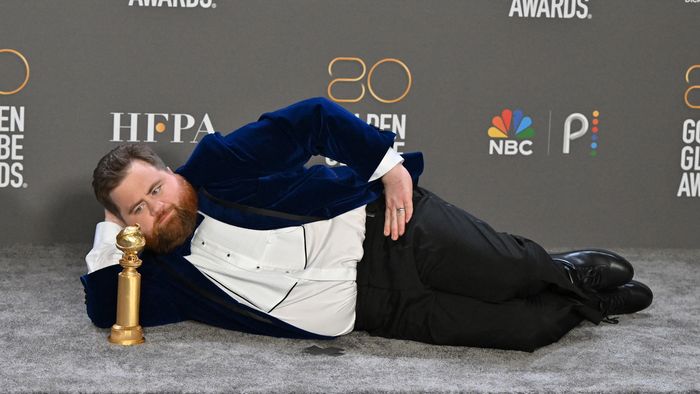 US actor Paul Walter Hauser poses with the award for Best Supporting Actor - Television Limited Series/Motion Picture for "Black Bird" in the press room during the 80th annual Golden Globe Awards at The Beverly Hilton hotel in Beverly Hills, California, on January 10, 2023. 