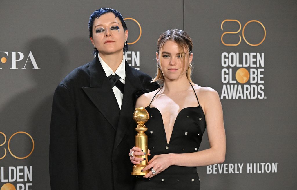 (From L) English actor Emma D'Arcy and Australian actress Milly Alcock pose with the award for Best Drama Series for "House of the Dragon" in the press room during the 80th annual Golden Globe Awards at The Beverly Hilton hotel in Beverly Hills, California, on January 10, 2023. 