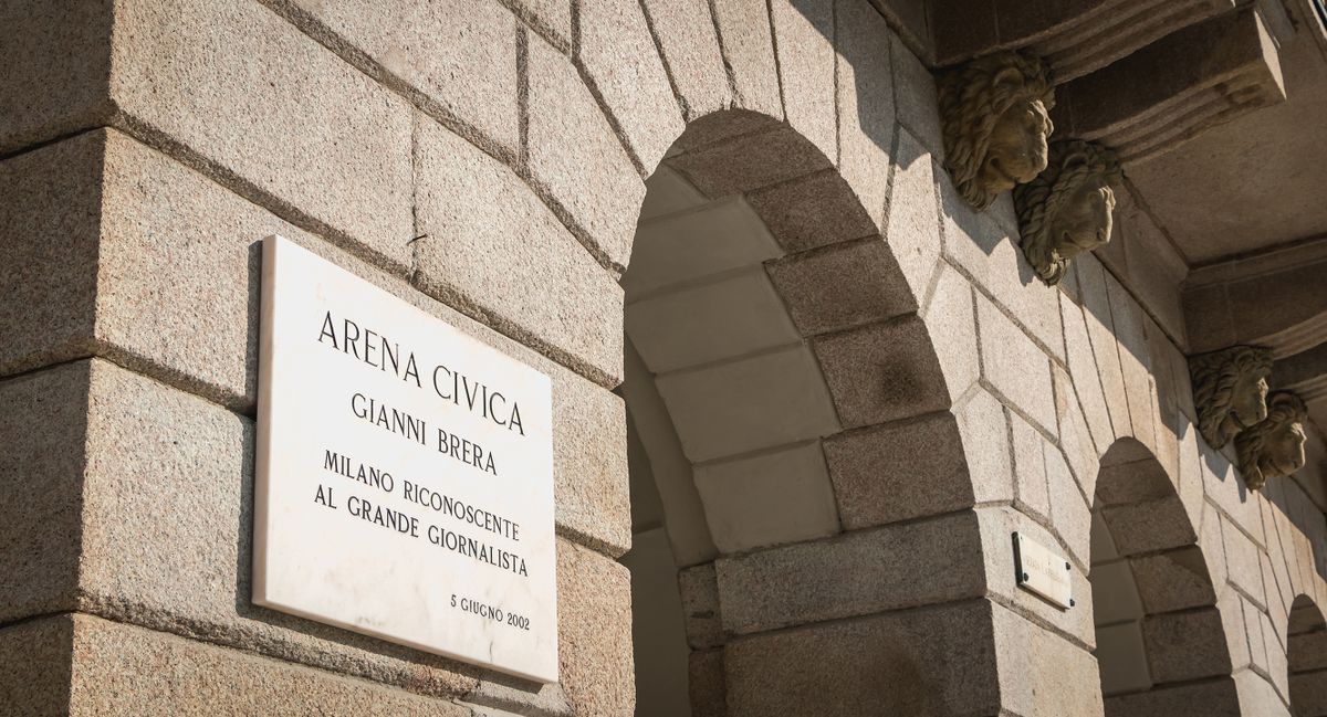 Milan, Italy - November 3, 2017: on a wall of the Arena Civica stadium, a street sign indicates the recognition of the city of Milan for the journalist Gianni Brera on June 2, 2002