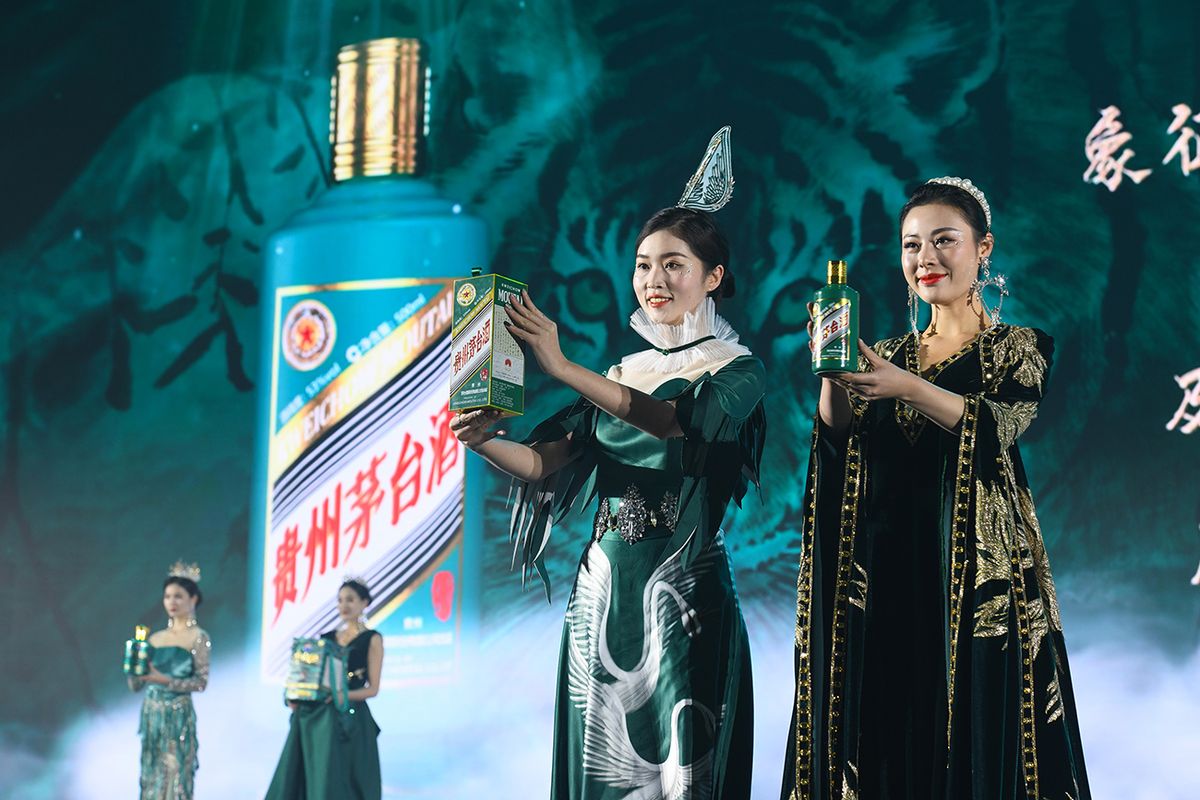 Kweichow Moutai Launches New Baijiu Products GUIYANG, CHINA - JANUARY 05: Models showcase bottles of Moutai's Baijiu products during a news conference for the launch of new Moutai Baijiu product on January 5, 2022 in Guiyang, Guizhou Province of China. (Photo by VCG/VCG via Getty Images)
