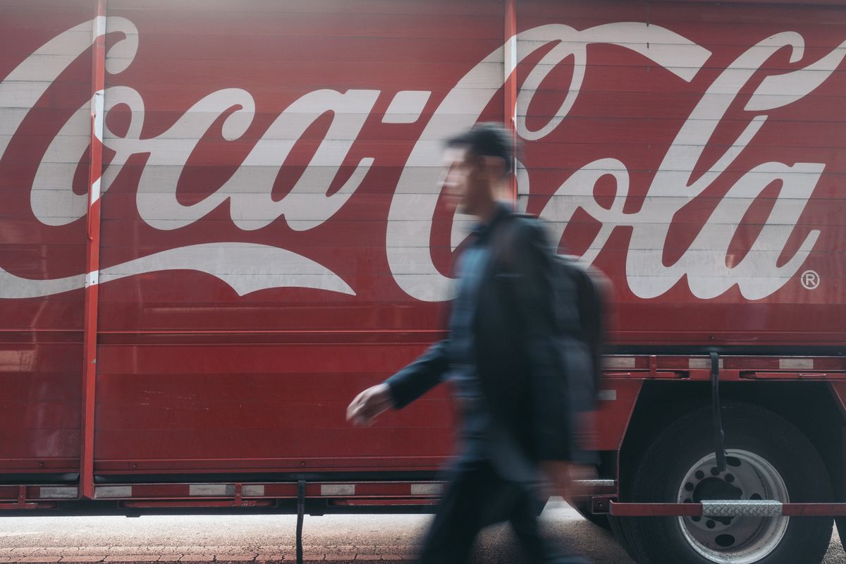 A pedestrian passes a Coca-Cola delivery truck in Mexico City, Mexico, on Wednesday, Jan. 25, 2023. The Latin American soft-drink market (all channels) grew 6% in 2022 to $128 billion. Off-trade channels accounted for 66% of the total vs. 68% in 2021.  