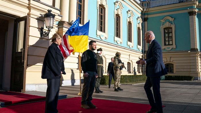 President Joe Biden (R) is greeted by Ukrainian President Volodymyr Zelensky and his wife Olena, outside Mariinsky Palace in Kyiv on February 20, 2023. - US President Joe Biden promised increased arms deliveries for Ukraine during a surprise visit to Kyiv on February 20, 2023, in which he also vowed Washington's "unflagging commitment" in defending Ukraine's territorial integrity.