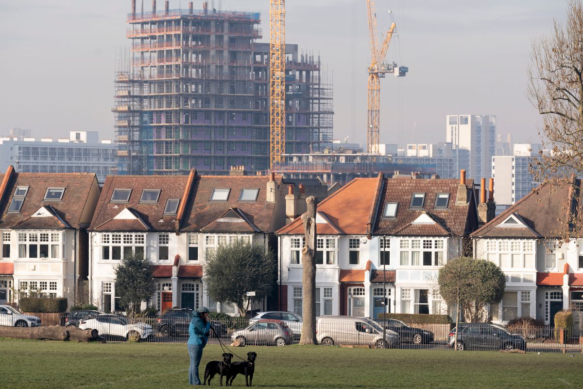Poor air quality partially obscures the tall high-rise residential development at Nine Elms beyond existing local housing bordering Ruskin Park in Lambeth, south London, on 23rd January 2023, in London, England. The construction in the foreground is Higgs Yard which will be a residential-led mixed-use development on the Higgs Industrial Estate in Loughborough Junction, London SE24. 134 new homes and 4,150m2 of commercial floorspace. 50% of the homes will be affordable. 
