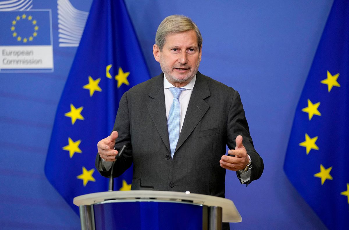 European Commissioner for Budget and Administration Johannes Hahn addresses a media conference at the EU headquarters in Brussels on December 22, 2021. (Photo by Virginia Mayo / POOL / AFP)