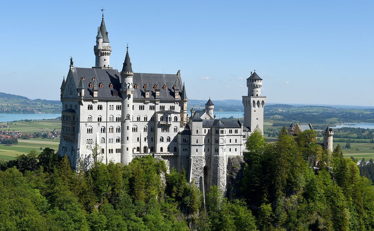 The iconic Neuschwanstein castle is pictured near the village of Hohenschwangau in southern Germany during its reopening on June 2, 2020, amid the novel coronavirus Covid-19 pandemic. - Famous for its fairy tale architecture, Neuschwanstein castle reopens after two and a half months of closure due to the Covid-19 crisis. (Photo by Christof STACHE / AFP)