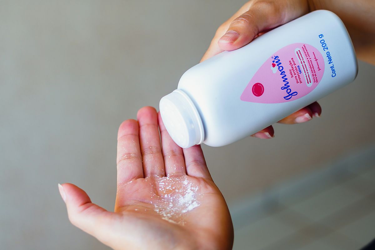 August,25,,2022,,Brazil.,In,This,Photo,Illustration,,A,Person August 25, 2022, Brazil. In this photo illustration, a person uses Johnson  Johnson baby powder on their hands. The company will suspend the sale of the product from 2023