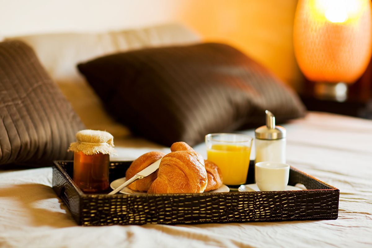 Photo,Of,Tray,With,Breakfast,Food,On,The,Bed,Inside photo of tray with breakfast food on the bed inside a bedroom, idegenforgalom, hotel, szálloda, panzió, ksh,