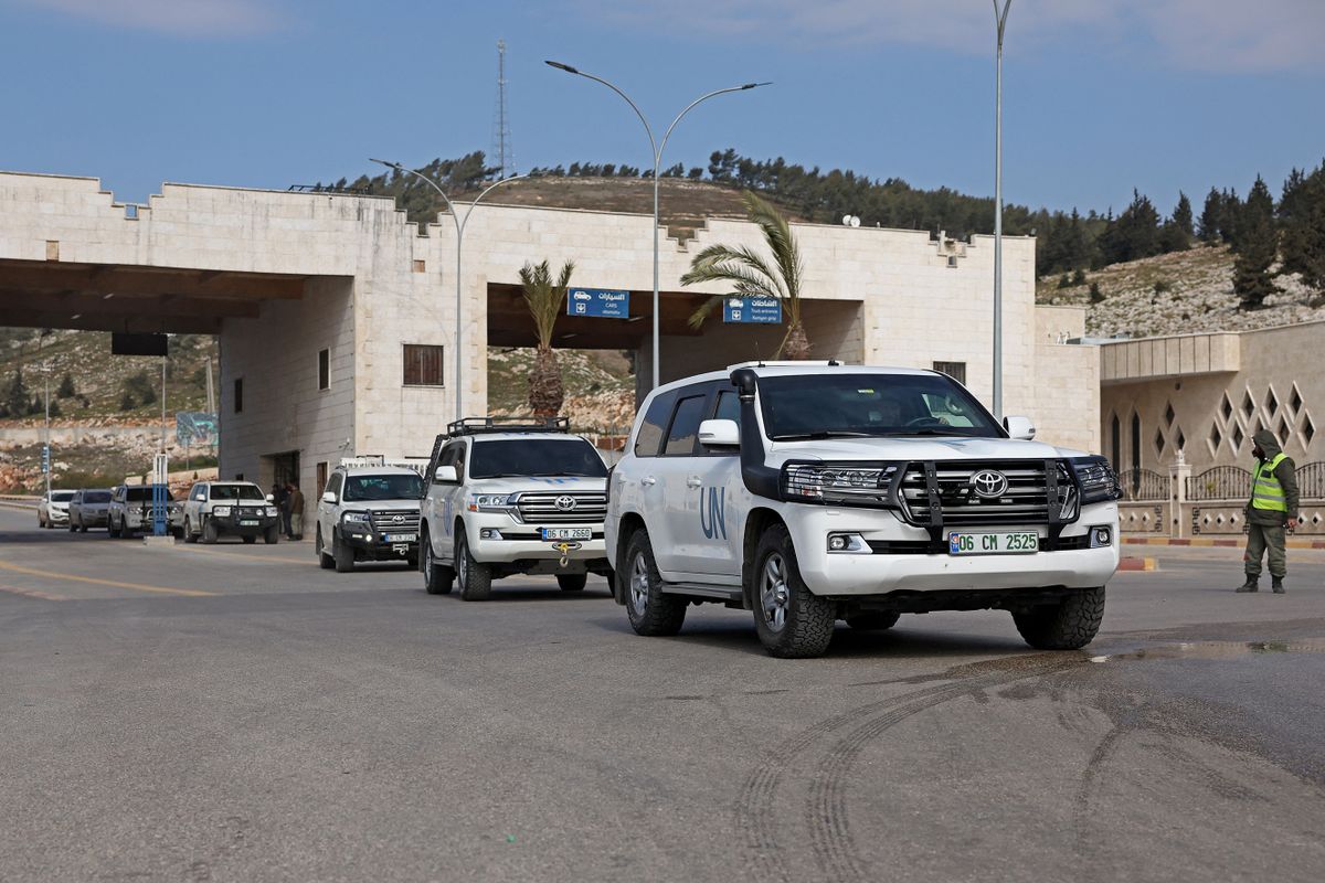 Vehicles carrying the first UN delegation to visit rebel-held northwestern Syria, arrive through the Bab al-Hawa border crossing with Turkey on February 14, 2023. 