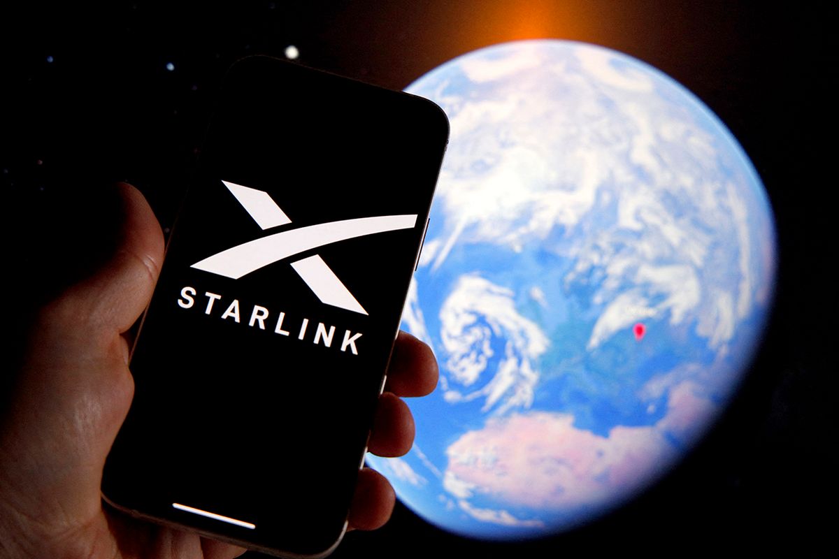 Starlink Resumes Service In Ukraine
The Starlink logo is seen on a mobile device with an grahpic illustration of planet Earth in this illustration photo in Warsaw, Poland on 21 September, 2022. Starlink owner and founder Elon Musk Starlink owner Elon Musk has decided to have the satellite company resume internet services in Ukraine after complaints of Starlink owner Elon Musk has decided to have the satellite company resume internet services in Ukraine after complaints of substantial costs. The satellite service, provided for free, is essential to the armed forces of Ukraine batteling Russian forces. (Photo by STR/NurPhoto) (Photo by NurPhoto / NurPhoto via AFP)