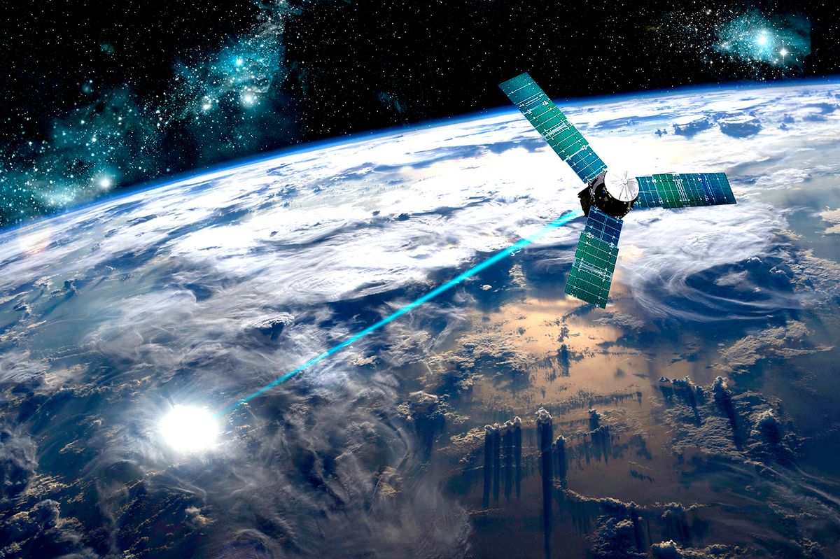 A composite image of a satellite firing an energy weapon at a target on Earth. A composite image of a satellite firing an energy weapon at a target on Earth.
