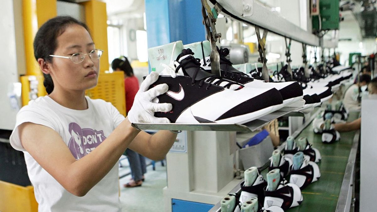 Company workers
Factory workers make Nike shoes at the factory of Yue Yuen Industrial (Holdings) Limited in Dongguan, Guangdong province September 20, 2005. (Photo by Lang shuchen / Imaginechina / Imaginechina via AFP) Factory workers make Nike shoes at the factory of Yue Yuen Industrial (Holdings) Limited in Dongguan, Guangdong province September 20, 2005. (Photo by Lang shuchen / Imaginechina / Imaginechina via AFP)