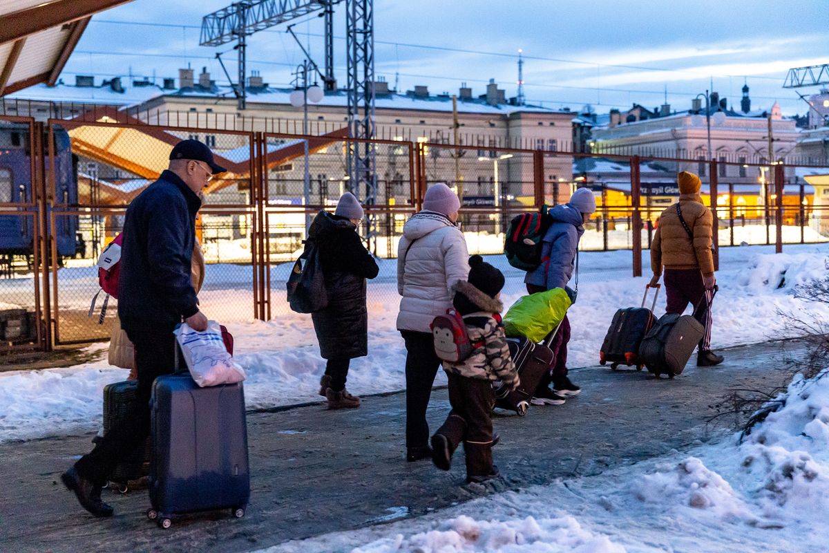 A family arrive at the railway station in Przemysl, Poland from Ukraine on December 20, 2022. Since the beginning of the Russian invasion on Ukraine more than 7 million Ukrainian refugees crossed the Polish border to flee the conflict. Since than many Ukrainians returned to their homeland or moved on to various destinations.  Today more Ukrainian travel back to Ukraine than escape it. 