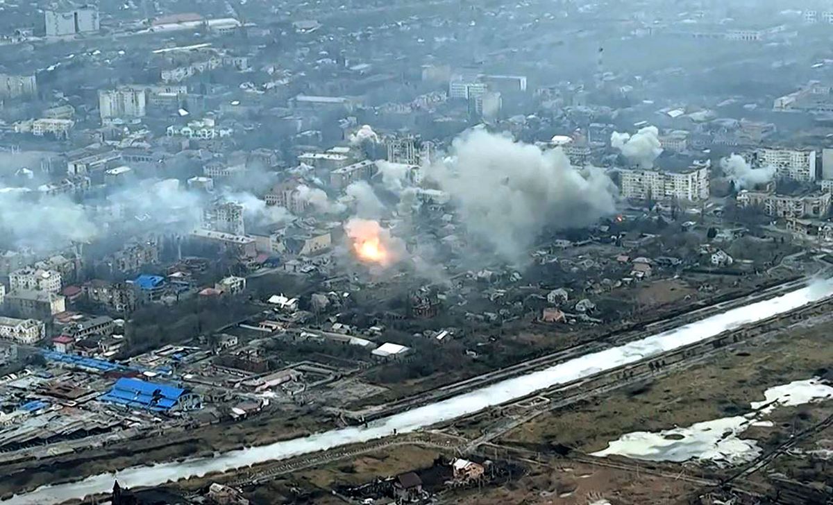 This video grab taken from a shooting by AFPTV shows an aerial view of smoke and destructions during fighting in the city of Bakhmut on February 27, 2023. Ukraine said on February 28, 2023 its forces were under pressure in Bakhmut, a nearly-destroyed city in the eastern Donetsk region that Russia has been trying to seize for months. This battle, the longest-running of Russia's year-long invasion, has involved mass artillery strikes, made high casualties on both sides, and reduced the city to rubble.