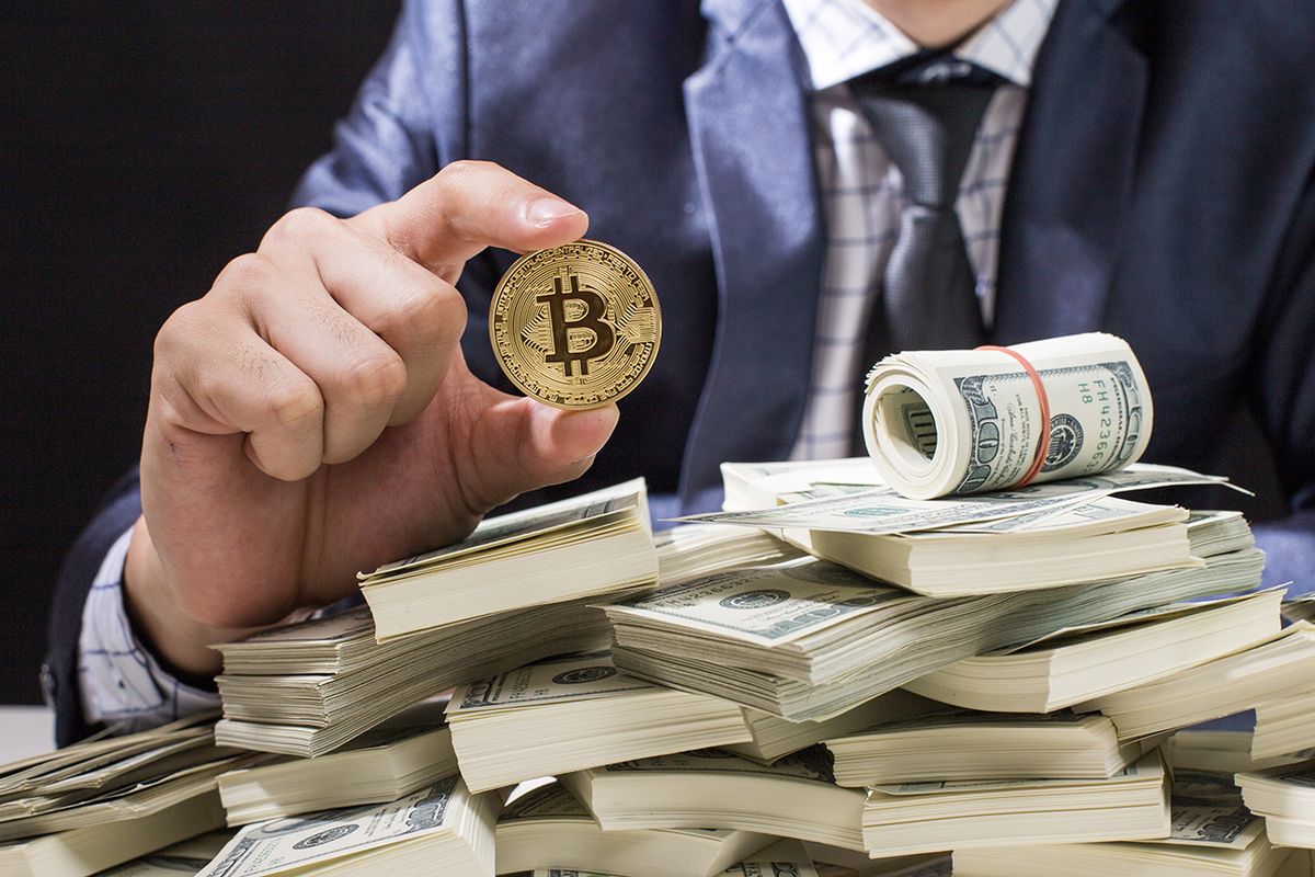 Businessman,Receive,A,Lot,Of,Money,From,Smartphone,,Businessman,Holding Businessman receive a lot of Money from Smartphone, Businessman Holding Bitcoin Isolated on black background, Digital Money and Bitcoine Concept.