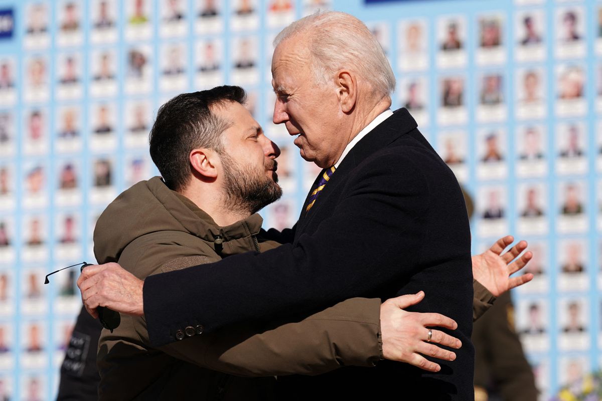 US President Joe Biden (R) is greeted by Ukrainian President Volodymyr Zelensky (L) during a visit in Kyiv on February 20, 2023. - US President Joe Biden made a surprise trip to Kyiv on February 20, 2023, ahead of the first anniversary of Russia's invasion of Ukraine, AFP journalists saw. Biden met Ukrainian President Volodymyr Zelensky in the Ukrainian capital on his first visit to the country since the start of the conflict