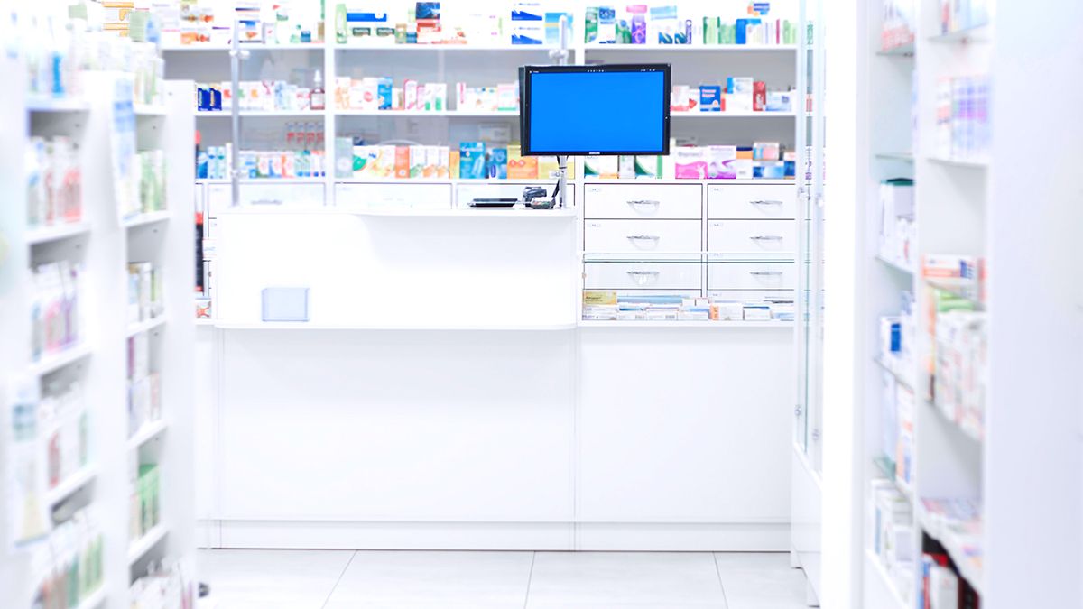 Inside view of cash register and shelves with medicines in the pharmacy
Inside view of cash register and shelves with medicines in the pharmacy
