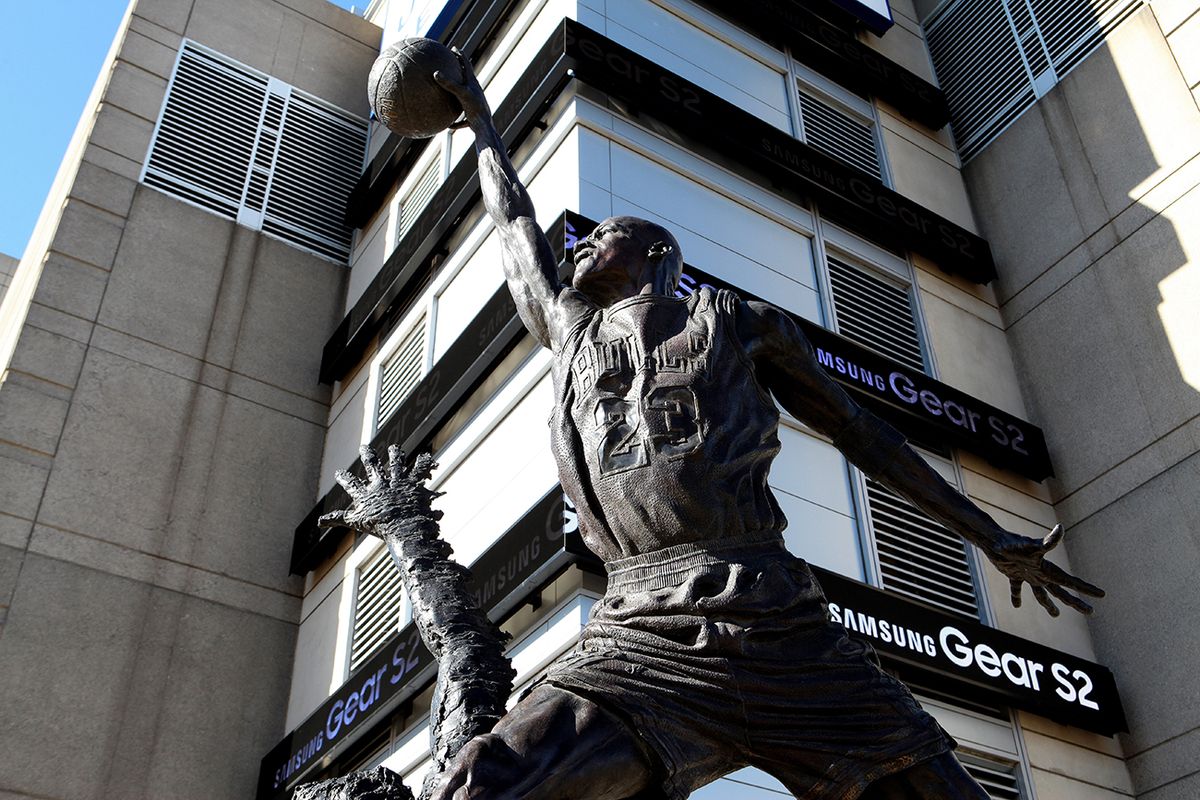 Chicago Cityscapes And City Views CHICAGO - NOVEMBER 02:  Omri Amrany and Julie Rotblatt-Amrany's Michael Jordan statue, officially known as 'The Spirit' sits outside the United Center, home of the Chicago Bulls basketball team and Chicago Blackhawks hockey team in Chicago, Illinois on November 2, 2015.  (Photo By Raymond Boyd/Getty Images)  