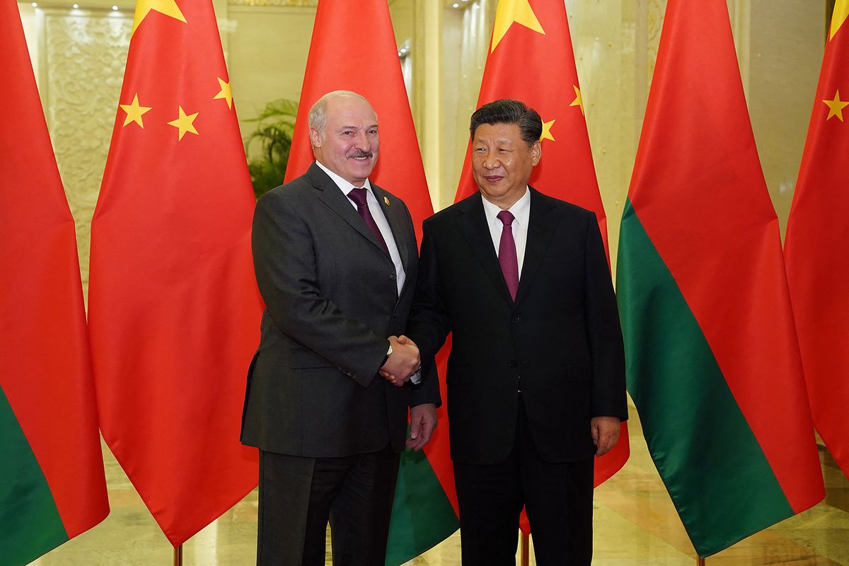 Belarus President Alexander Lukashenko (L) shakes hands with China's President Xi Jinping (R) as they meet at the Great Hall of the People in Beijing on April 25, 2019. - Leaders from 37 countries have been converging in Beijing for the Belt and Road Forum on April 25, hoping to grab a piece of the 1 trillion USD pie to improve their infrastructure. (Photo by Andrea VERDELLI / POOL / AFP)