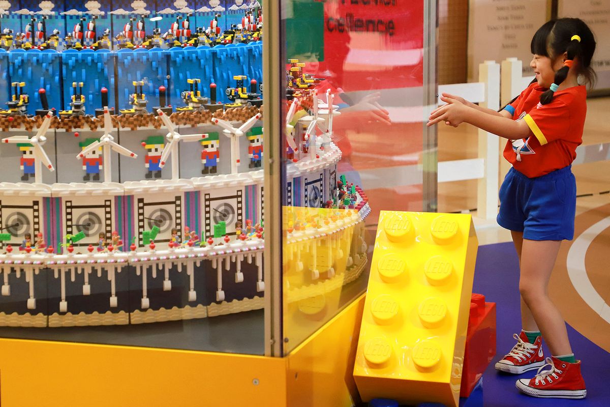 A fun day not to forget A girl reacts to a Lego creation being showcased at Lego Kids Day 2023, The Imagination Village, at Siam Paragon shopping complex. Entry is free of charge and the event ends 15 January 2023. (Photo by Somchai Poomlard / Bangkok Post / Bangkok Post via AFP)