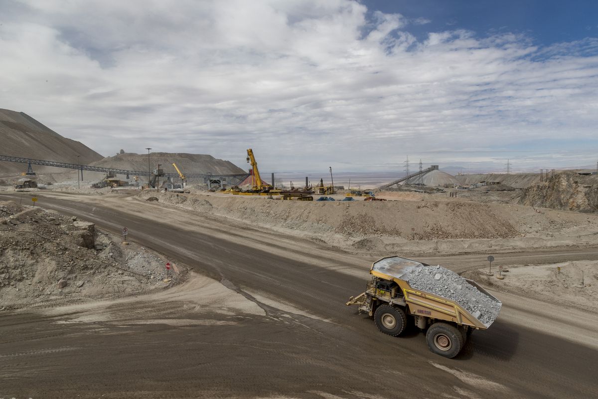 A truck transports minerals inside the Codelco Chuquicamata open pit copper mine near Calama, Chile, on Thursday, Aug. 2, 2018. Protests at the Chuquicamata copper mine in late July were the first labor disruptions in Chile this year, and happened amid calls for a strike from the union at the world's largest mine, BHP Billiton Ltd.'s Escondida. : 