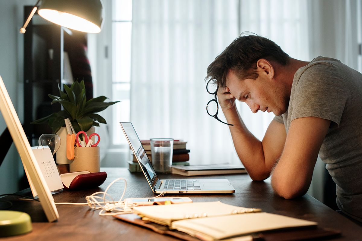 Man stressed while working on laptop
Man stressed while working on laptop