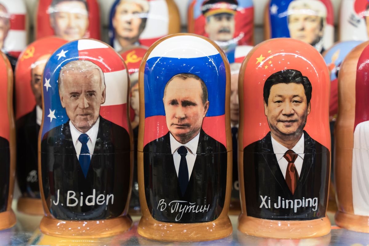 Moscow , Russia - February 26, 2022: Putin, Biden and Xi Jinping in the form of Russian nesting dolls in a gift shop in Moscow. Relations between Russia, USA and China