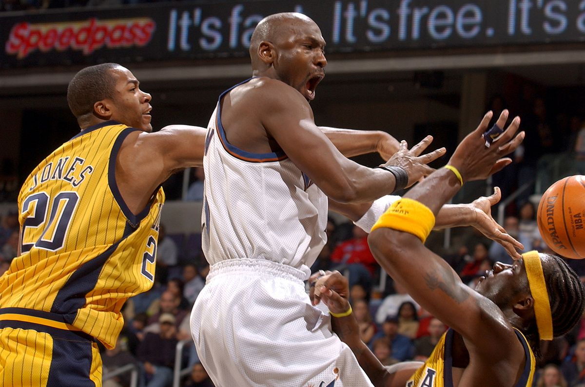 Indiana Pacers v Washington Wizards
WASHINGTON, DC - JANUARY 4: Michael Jordan #23 of the Washington Wizards passes the ball against the Indiana Pacers  on January 4, 2003 at the MCI Center in Washington DC.  NOTE TO USER: User expressly acknowledges and agrees that, by downloading and or using this photograph, User is consenting to the terms and conditions of the Getty Images License Agreement. (Photo by G Fiume/Getty Images)