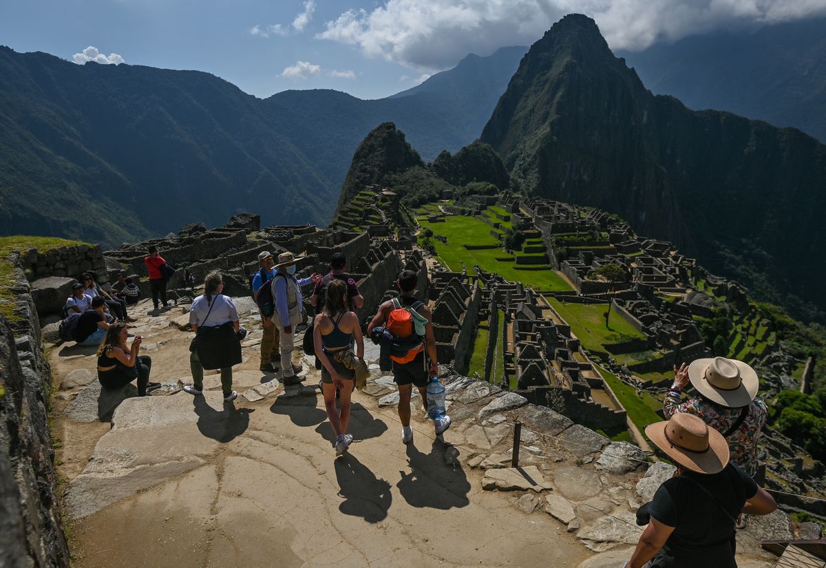 Tourists explore the ancient Inca city of Machu Picchu located in the Andes at an altitude of 2,430 meters (7,970 feet).The most famous icon of the Inca civilization was declared a Peruvian Historical Sanctuary in 1981, a UNESCO World Heritage Site in 1983, and in 2007 was then declared one of the Seven New Wonders of the World.On Wednesday, 20 April 2022, in Historic Sanctuary of Machu Picchu, Urubamba Province, Peru. 