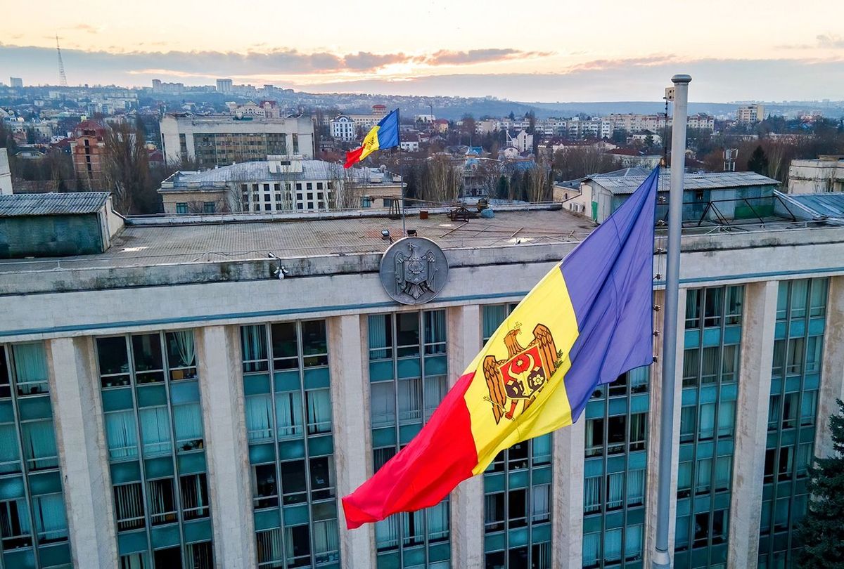 Aerial,Drone,View,Of,Government,House,At,Sunset.,Building,With Aerial drone view of Government House at sunset. Building with flag and multiple buildings on the background, firs in Chisinau, Moldova