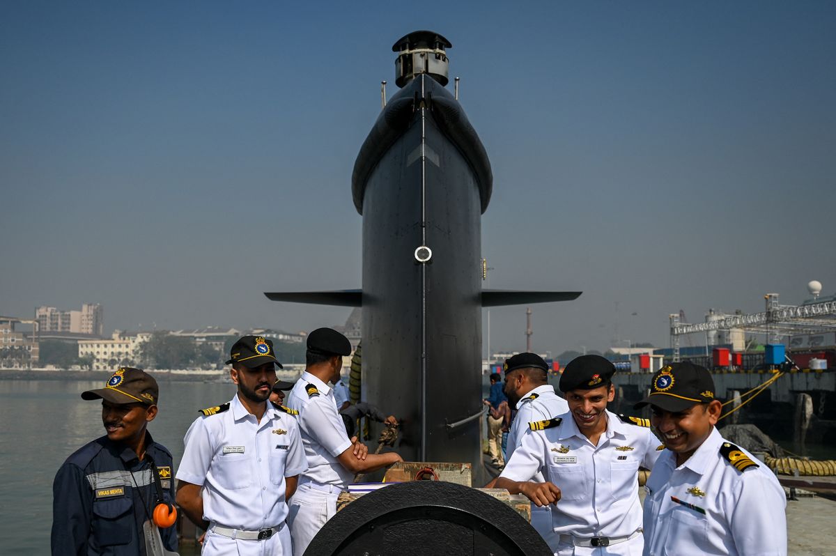 Indian navy officers interact on the deck of fifth Kalvari-Class submarine 'Vagir' anchored at the naval base ahead of its commissioning ceremony in Mumbai January 20, 2023. (
