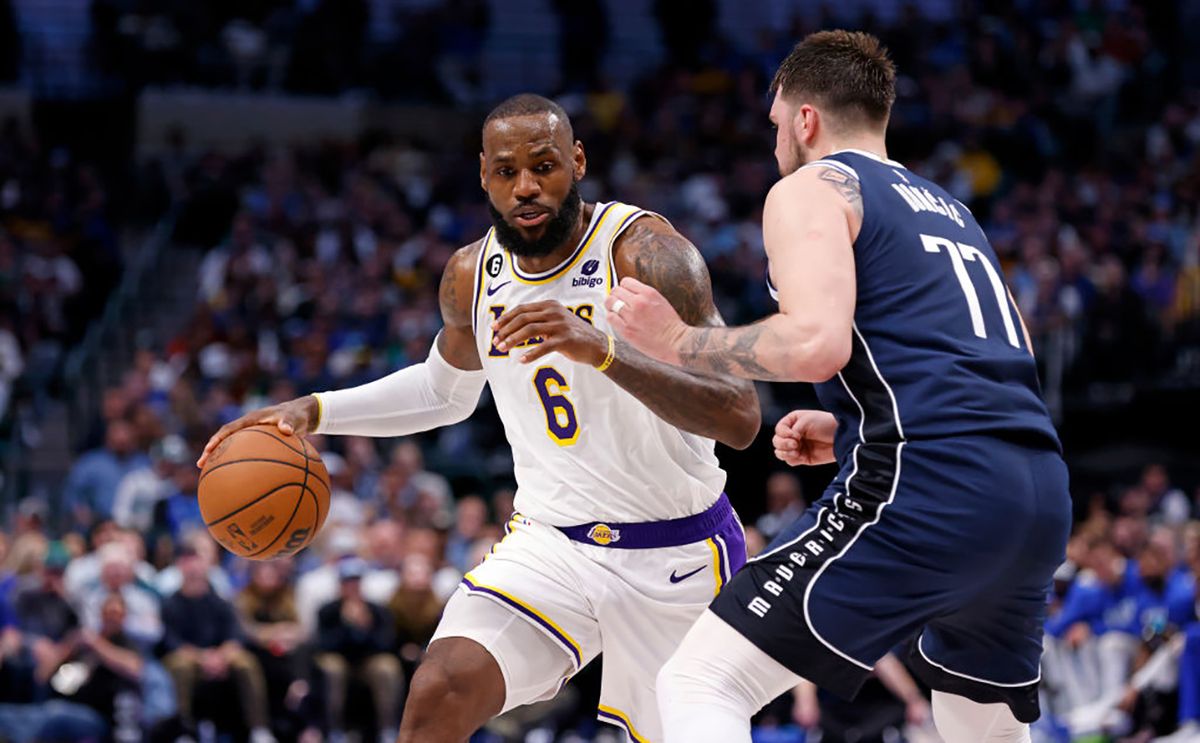 Los Angeles Lakers v Dallas Mavericks
DALLAS, TX - FEBRUARY 26 : LeBron James #6 of the Los Angeles Lakers handles the ball as Luka Doncic #77 of the Dallas Mavericks defends in the second half at American Airlines Center on February 26, 2023 in Dallas, Texas. The Lakers won 111-108. NOTE TO USER: User expressly acknowledges and agrees that, by downloading and or using this photograph, User is consenting to the terms and conditions of the Getty Images License Agreement. (Photo by Ron Jenkins/Getty Images)