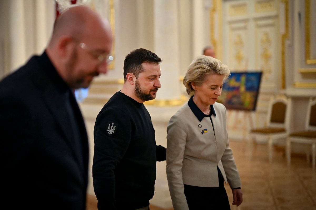 This handout picture taken and released by the Ukrainian Presidential press-service on February 3, 2023, shows European Council President Charles Michel (L), Ukrainian President Volodymyr Zelensky (C), European Commission President Ursula von der Leyen (R) walking during an EU-Ukraine summit in Kyiv. and European Commission President Ursula von der Leyen taking part in a meeting of the European Commission and Ukraine's government, in Kyiv.