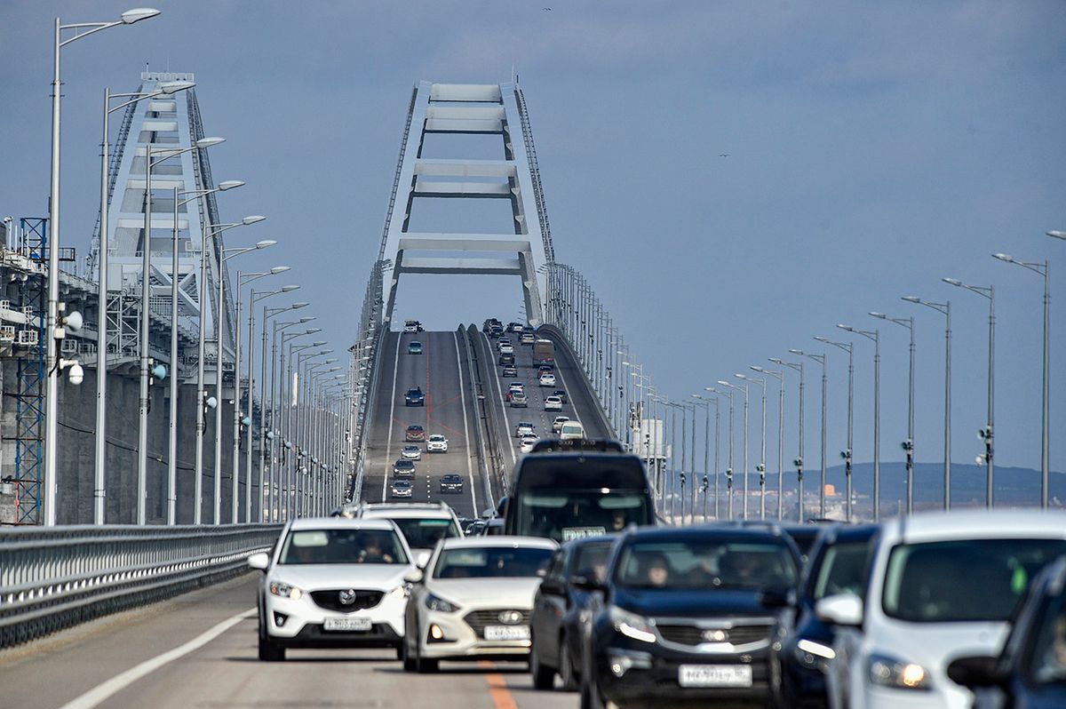 Russia announces full reopening to road traffic of the Crimean Bridge after repairs following the October explosion epa10485423 Cars drive across the Crimean bridge in Crimea, 23 February 2023. Automobile traffic resumed on all lanes of the Crimean bridge on 23 February, 39 days ahead of schedule, the press service of Russia's Deputy Prime Minister Marat Khusnullin announced. The motorway of the Crimean Bridge was damaged by an explosion last October. To restore the bridge, some 2,442 tons of metal structures were manufactured, which were delivered from Tyumen, Voronezh and Kurgan. The builders needed to replace four spans on both sides of the bridge, lay two layers of asphalt concrete pavement and install lighting masts.  EPA/STRINGER