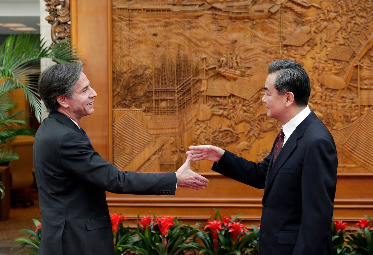 BEIJING, CHINA - FEBRUARY 11:  (L-R) U.S. Deputy Secretary of State Antony Blinken shakes hand with Chinese Foreign Minister Wang Yi at the Olive Hall before a meeting at the Foreign Ministry office on February 11, 2015 in Beijing, Australia. 