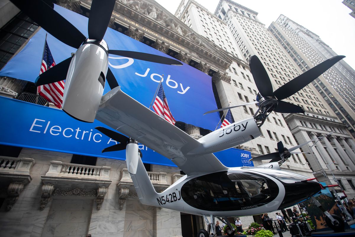A Joby Aviation Inc. Electric Vertical Take-Off and Landing (eVTOL) aircraft outside the New York Stock Exchange (NYSE) during the company's initial public offering in New York, U.S., on Wednesday, Aug. 11, 2021. Joby Aviation, which promises to build and operate a commercial fleet of aerial taxis by 2024, began trading Wednesday, testing the imaginations of public investors. The shares surged more than 12% during the first hour of trading. 