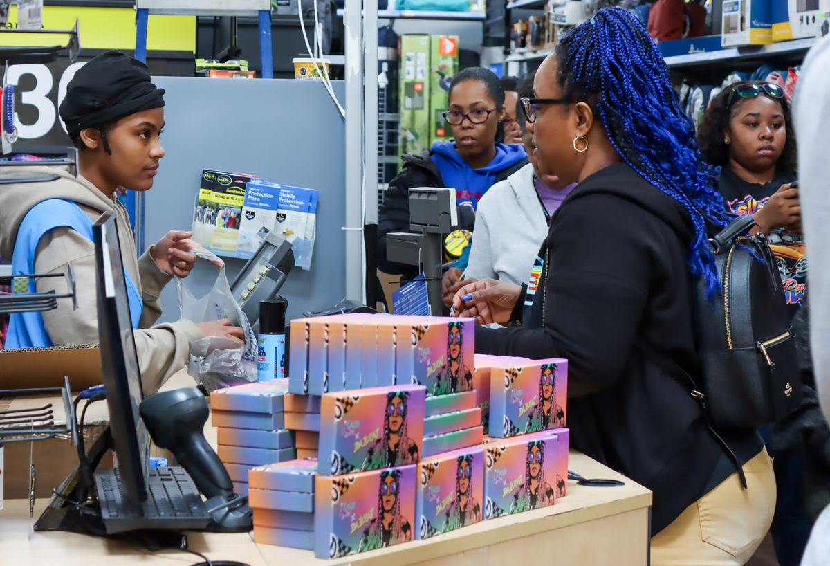 DECATUR, GEORGIA - FEBRUARY 18: Guests purchase Kaleidoscope products at Da Brat x Judy Meet and Greet at Walmart Supercenter on February 18, 2023 in Decatur, Georgia. 