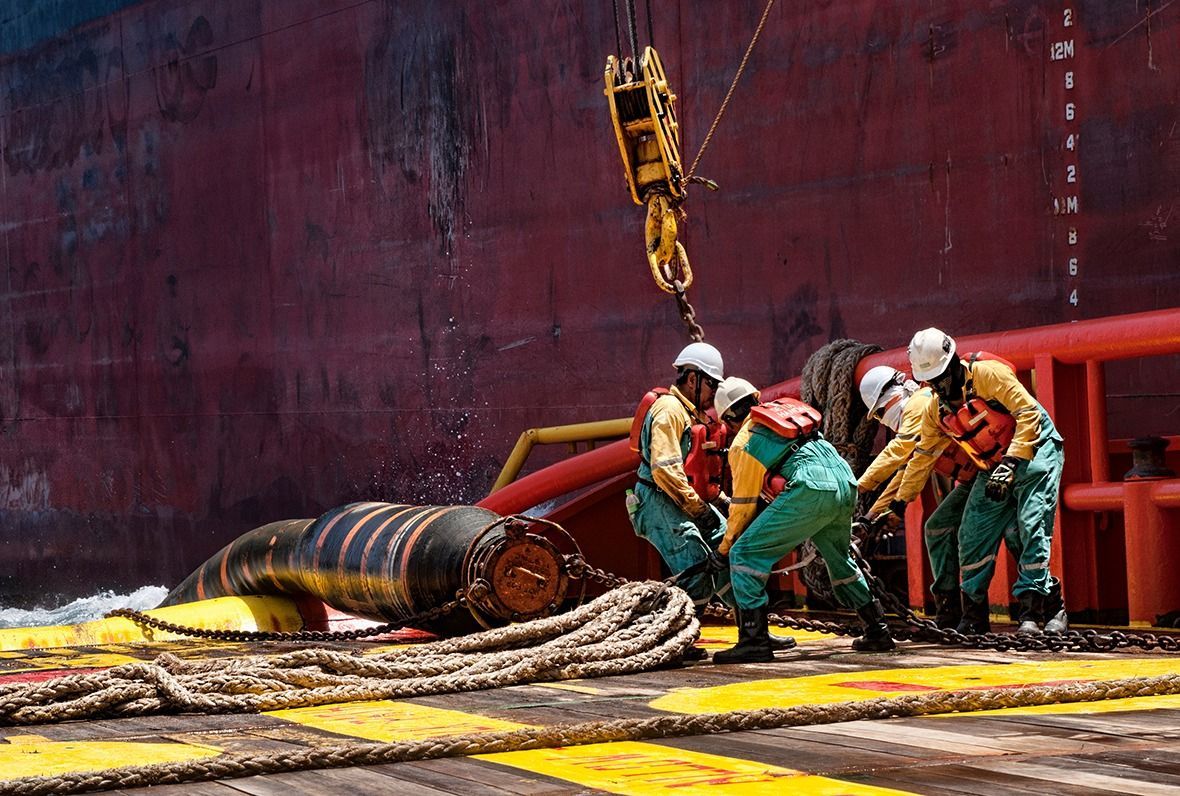 Terengganu,,Malaysia,-,10,March,2015,,Offshore,Marine,Crew,Connecting
TERENGGANU, MALAYSIA - 10 MARCH 2015, offshore marine crew connecting cargo hose for crude oil transfer