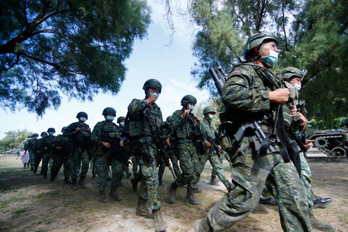 Soldiers in procession during a shore defense operation as part of a military exercise simulating the defense against the intrusion of Chinese military, amid rising tensions between Taipei and China, in Tainan, Taiwan, 11 November 2021. The self governing island has been receiving increasing assistance from the US while building better relations with the UK, Australia, France and other European countries including Lithuania, Czech Republic, Poland and so on. 