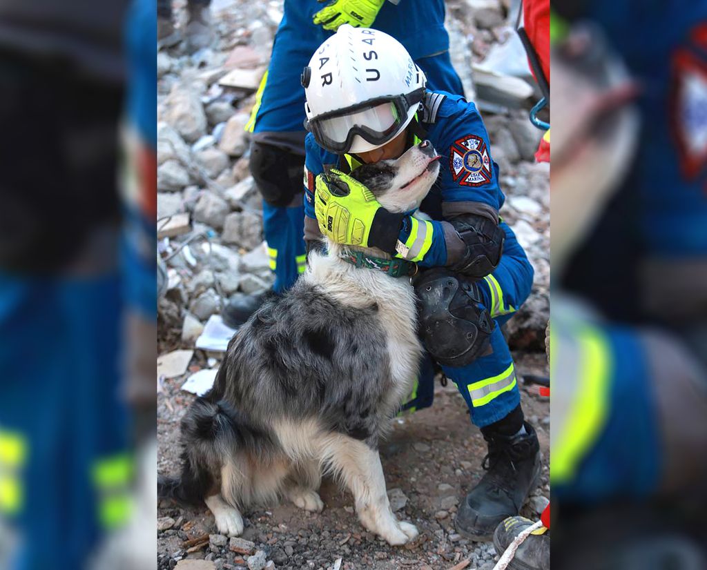 Handout picture released by the Mexican Ministry of Foreign Affairs showing quake rescue dog "Balam" being caressed by a Mexican rescuer during rescue efforts after the 7.8-magnitude earthquake that struck Turkey and Syria, in Adiyaman, Turkey, on February 9, 2023. - Time was running out for survivors buried in the rubble of the earthquake in Turkey and Syria, as search efforts near the crucial 72-hour mark, a rescue response expert said Wednesday. (Photo by Mexican Ministry of foreign Affairs / Mexican Foreign Ministry / AFP) / RESTRICTED TO EDITORIAL USE - MANDATORY CREDIT "AFP PHOTO / MEXICAN FOREIGN MINISTRY" - NO MARKETING - NO ADVERTISING CAMPAIGNS - DISTRIBUTED AS A SERVICE TO CLIENTS