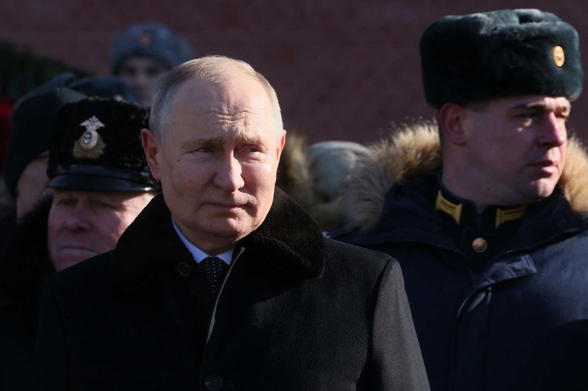 Russian President Vladimir Putin  attends a wreath-laying ceremony at the Eternal Flame and the Unknown Soldier's Grave in the Alexander Garden during an event marking Defender of the Fatherland Day in Moscow on February 23, 2023. 