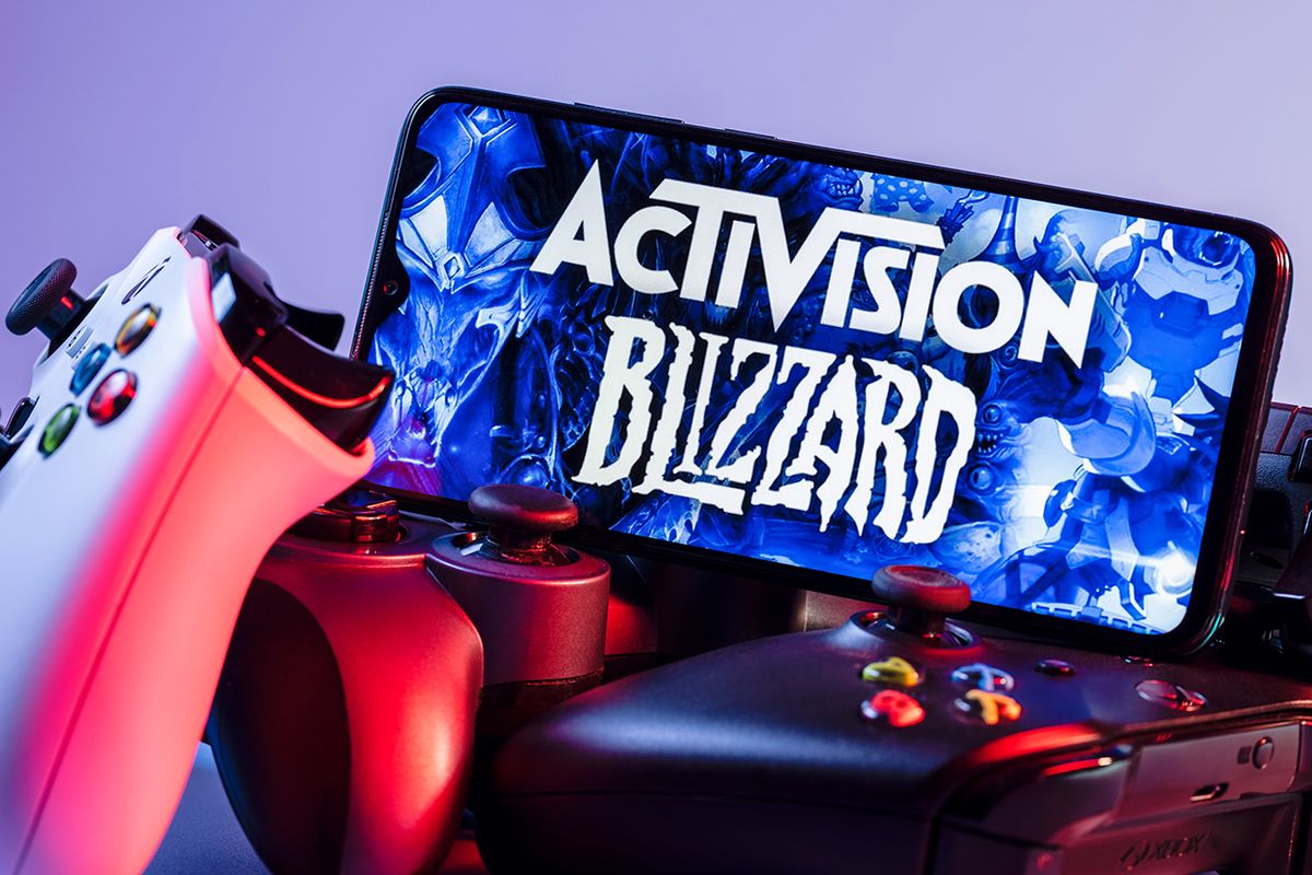 Kazan,,Russia,-,August,7,,2021:,Activision,Blizzard,,Inc.,Is Kazan, Russia - August 7, 2021:  Activision Blizzard, Inc. is an American video game holding company. A smartphone with the Activision Blizzard logo on the screen on the pile of the gamepads.