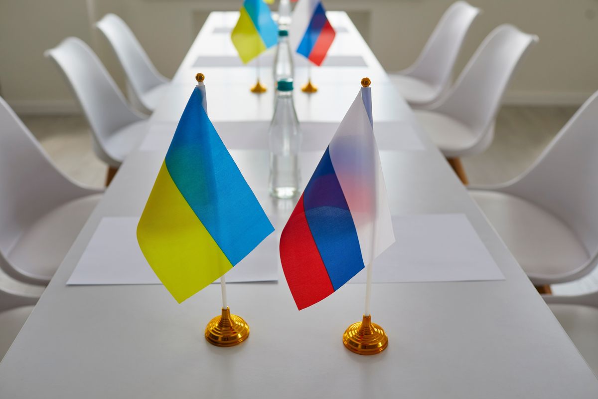 Ukraine,And,Russia,Flags,On,Negotiation,Table,Before,Delegates,Start