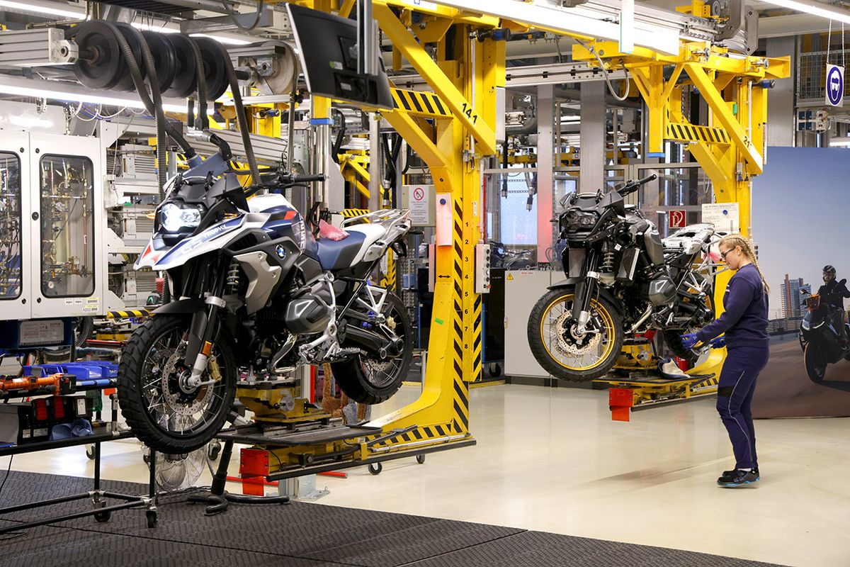 Scholz Visits BMW Motorcycle Factory
BERLIN, GERMANY - DECEMBER 19: A female trainee works on the assembly line at the BMW motorcycle manufacturing plant on December 19, 2022 in Berlin, Germany. The plant, opened in 1967, produces over 550 gasoline and electric powered motorcycles and scooters per day.  (Photo by Sean Gallup/Getty Images)