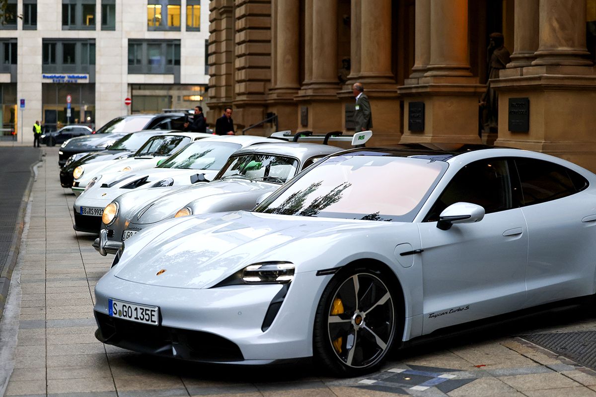 Porsche Set for Bold Trading Debut After Pricing at Top End
Porsche luxury automobiles outside the Frankfurt Stock Exchange, operated by Deutsche Boerse AG, ahead of the Porsche AG initial public offering in Frankfurt, Germany, on Thursday, Sept. 29, 2022. Porsche is set for a bullish trading debut after parent Volkswagen AG set the final listing price for the sports-car maker at the upper limit, seeking to defy deep market upheaval. Photographer Alex Kraus/Bloomberg via Getty Images