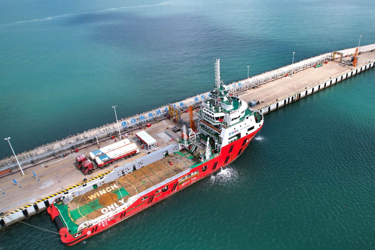 CHINA-HAINAN-OFFSHORE LNG FILLING STATION (CN) (211121) -- HAIKOU, Nov. 21, 2021 (Xinhua) -- Aerial photo taken on Nov. 20, 2021 shows a berthed ship being filled with liquefied natural gas (LNG) at an LNG filling station in Macun port of Chengmai County, south China's Hainan Province. The offshore LNG filling station, built and operated by China National Offshore Oil Corporation (CNOOC) Gas & Power Group, opened for operation on Saturday in Macun port of Hainan Province. (Xinhua/Yang Guanyu) (Photo by Yang Guanyu / XINHUA / Xinhua via AFP)